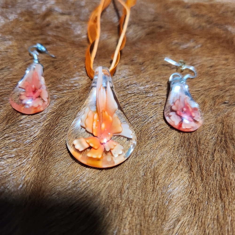 Matching orange blown glass necklace and earrings